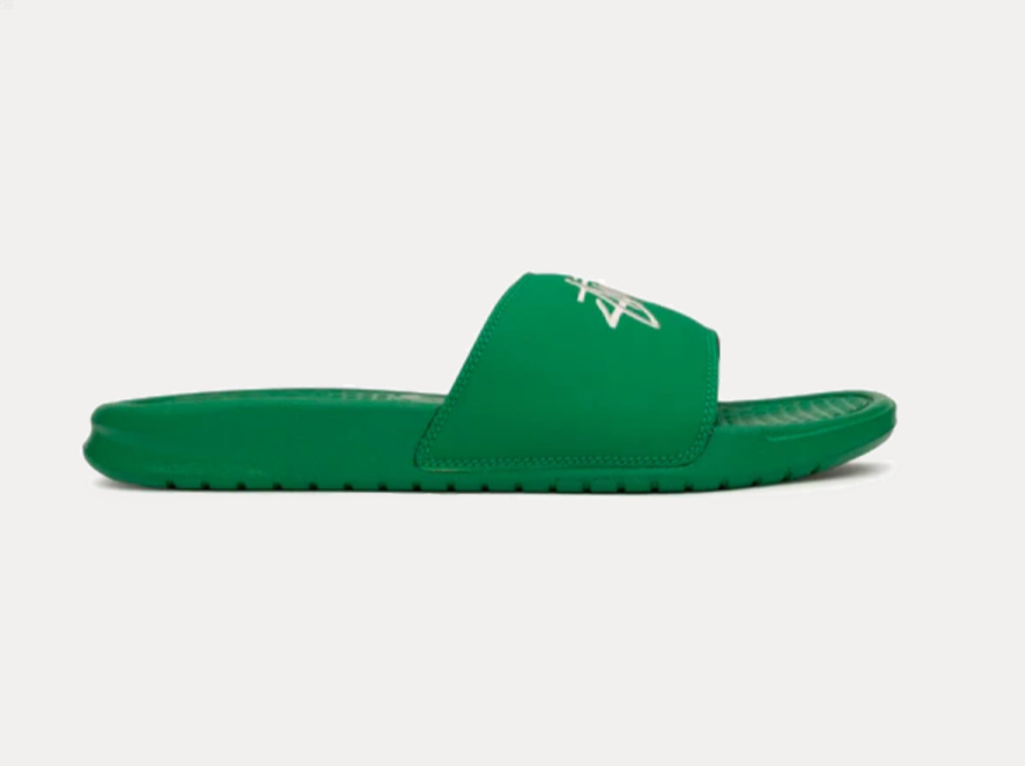 Green and store white nike slides